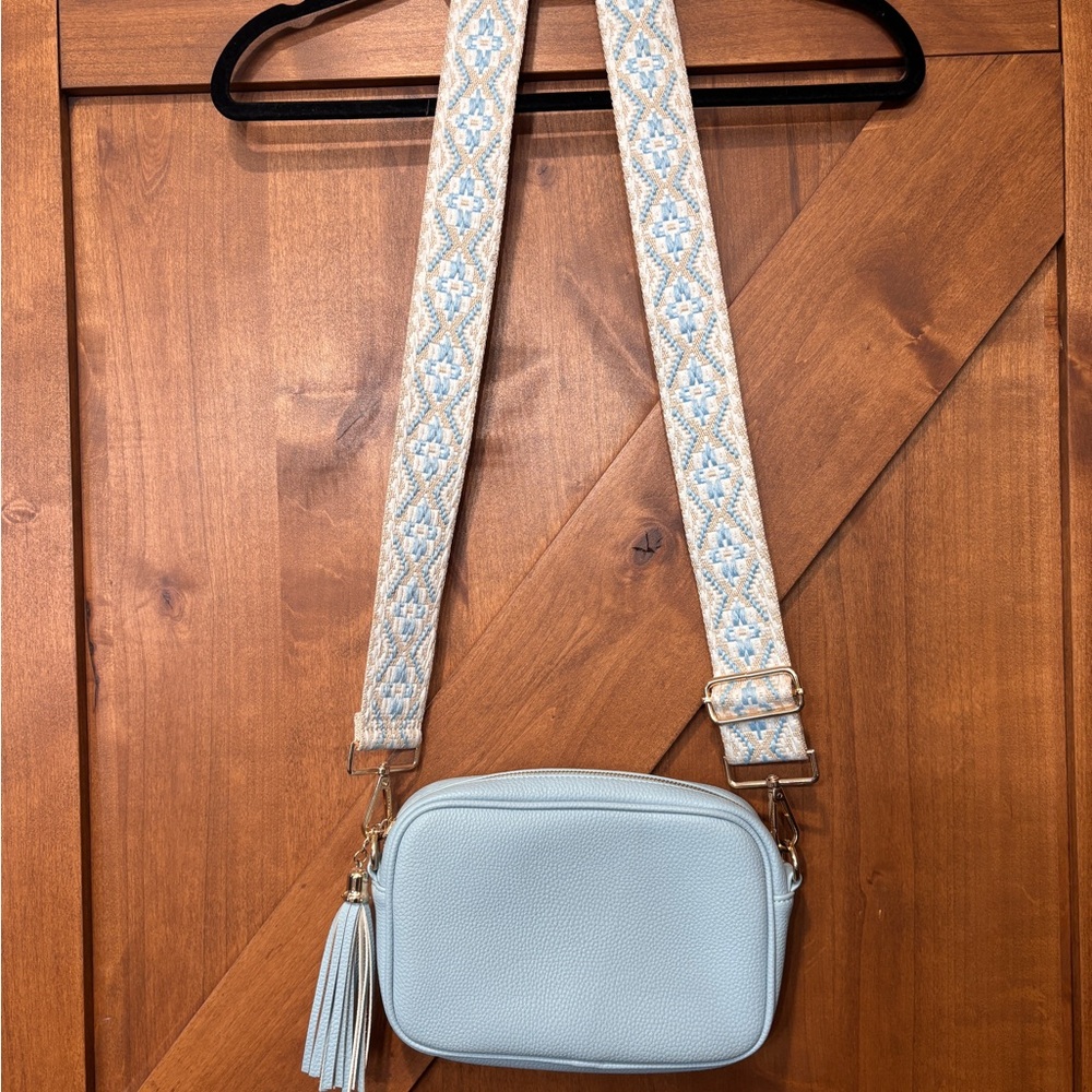 Stylish Blue Crossbody Bag with Patterned Strap